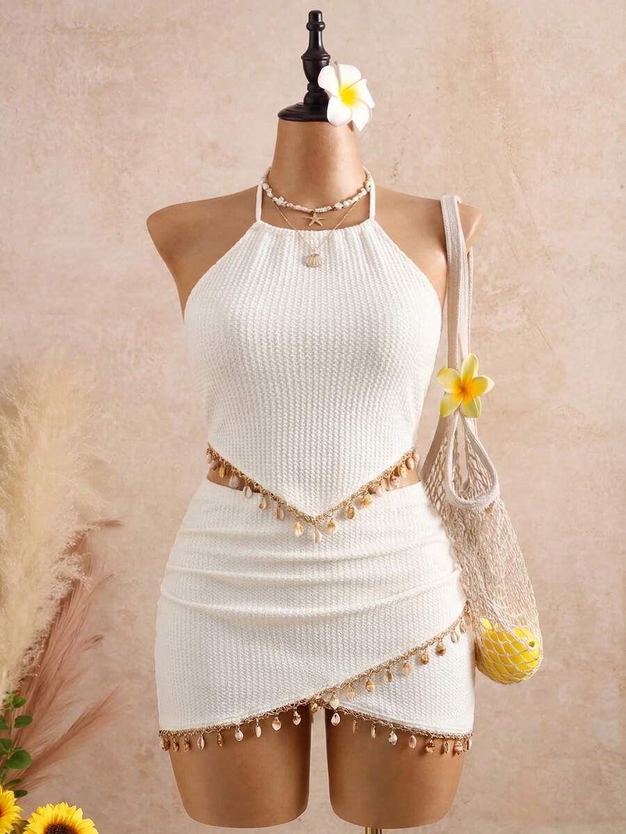 Breezaya Bộ đồ 2 món gồm áo croptop và chân váy ngắn ôm sát, chất liệu dệt kim họa tiết, có tua rua, thích hợp cho đi biển, kỳ nghỉ, lễ hội âm nhạc. - Màu be - Xem 1