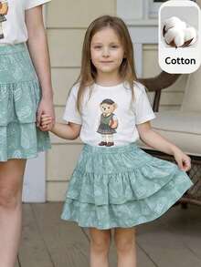 PrepCrw 2 pièces Tenue décontractée élégante pour jeunes filles en vacances, style urbain pour l'école. T-shirt en tricot à col rond blanc à manches courtes et jupe verte assortie. Convient pour la rentrée scolaire, le port quotidien décontracté, les voyages, les fêtes, les festivals, le printemps et l'été - Multicolore - Voir 1