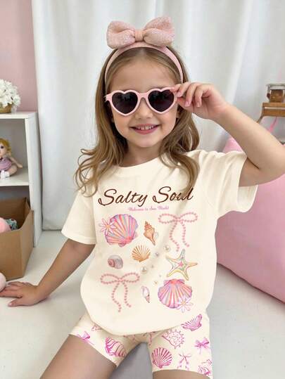 SHEIN 2pcs Young Girls Cream White "Salty Soul" Starfish, Shell, Pearl, Bow Graphic Short Sleeve Round Neck T-Shirt And Shorts Set, Casual Outfit For Young Girls, Suitable For Spring/Summer Daily Wear, Street Style, Vacation, Homecoming, Back To School