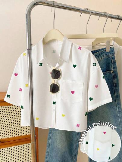 Resyla Camisa casual de mujer de manga corta con bolsillo frontal y estampado de corazón