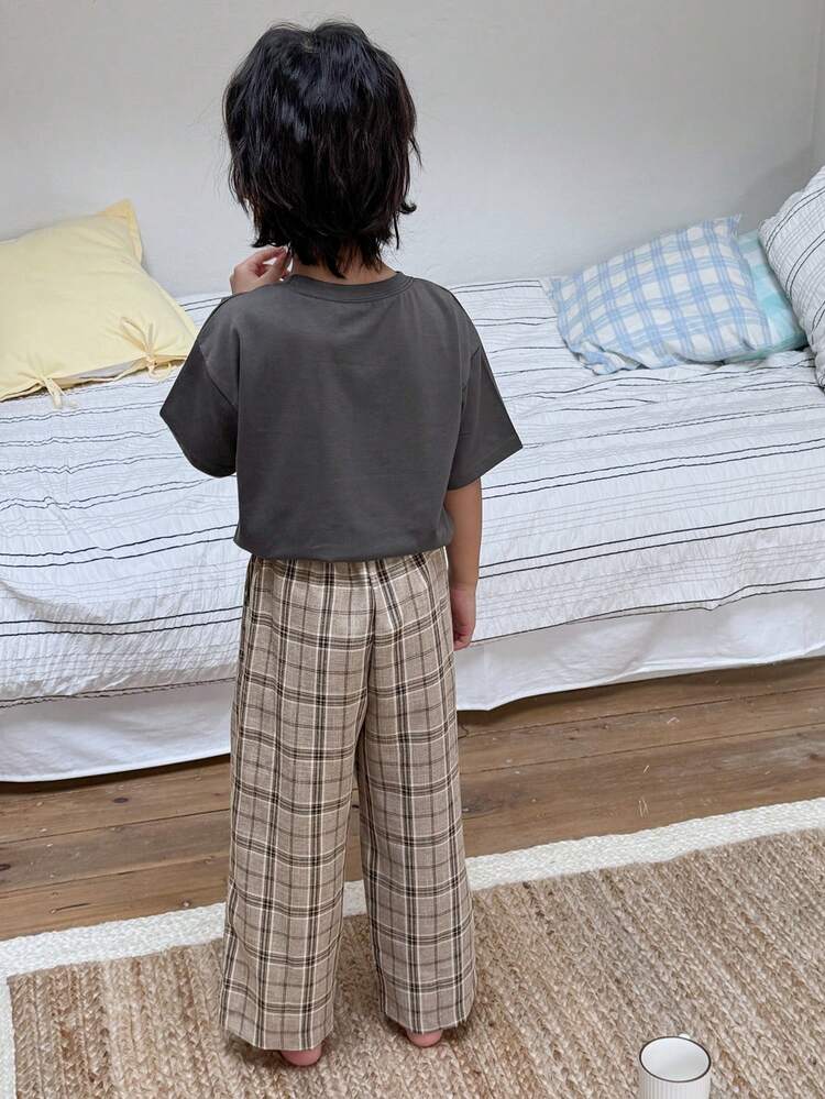 Young Boy Solid Color Round Neck Drop Shoulder T-Shirt And Plaid Long Pants Casual Outfit Spring