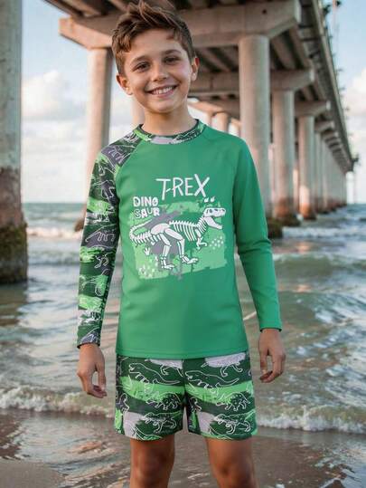 SHEIN Bộ đồ bơi thể thao hai mảnh in hình khủng long mới năm 2025 dành cho bé trai. Bộ đồ bơi này có thiết kế in hình khủng long độc đáo và bắt mắt trên nền xanh dương, thể hiện tinh thần mạnh mẽ và phiêu lưu. Chất liệu mềm mại và thoải mái phù hợp với nhiều hoạt động dưới nước. Thiết kế tay dài giúp che chắn hiệu quả khỏi ánh nắng mặt trời, bảo vệ làn da mỏng manh của trẻ nhỏ. Bộ đồ bơi mới năm 2025 này hoàn hảo cho các bé trai yêu thích bơi lội, giúp tăng thêm sự tự tin khi ở dưới nước.