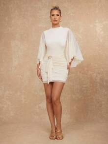 Lumalex 优雅象牙色女神迷你连衣裙,披肩袖,褶皱腰身,饰以雕塑感金色心形五金配件;早春柔软飘逸的多层网纱喇叭袖系带连衣裙;春夏优雅浪漫连衣裙;正式晚礼服;盛大晚宴;夏季连衣裙;女士夏季连衣裙;女士春季服装;情人节服装;沙滩连衣裙;沙滩装;2026年狂欢节女士造型;派对连衣裙;优雅女士派对连衣裙;女士婚礼宾客连衣裙;女士优雅连衣裙;女士度假服装;度假连衣裙;商务休闲;正式连衣裙;女士奢华晚礼服;情人节灵感;浪漫情人节氛围;女士休闲连衣裙;新少女风;波西米亚休闲风;低调奢华风格;适合派对、约会、外出、夜生活、婚礼、假日、度假、生日派对;夏季假日沙滩装;奢华造型;LuxeLooks;QuietLuxe;舞会聚会派对宴会 朴素的老钱狂欢节 层次丰富的派对 - 杏色 - 查看 4