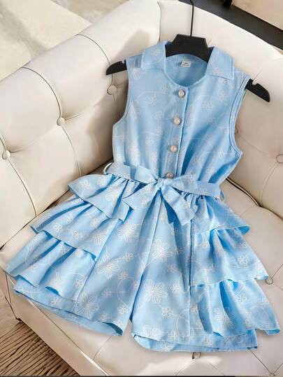 This Is A Pair Of Loose-Fitting, Casual Shorts For Girls. Made Of Woven Fabric With Printed Patterns And Imitating Embroidery Techniques, The Shorts Feature A Collarless Design And No Sleeves. They Have A Half-Open Front And A Belt At The Waist. Flouncing Trimmings Are Added On Both Sides, Making Them Ideal For Daily Casual Wear In Summer.