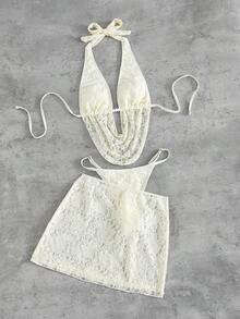 Swim SXY 这款女士欧美风性感大胆前卫的日常法式度假百搭泳衣套装，采用米白色蕾丝面料，饰以串珠配饰，系带露背吊带深V设计，搭配后背褶皱泳裤和外层蕾丝裙，三件套设计，适合春假、秋季返校季、啤酒节、音乐节、春季促销、海滩度假、春季派对、情人节等场合。 - 杏色 - 查看 5