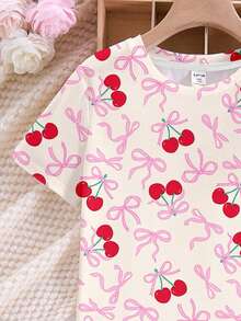 SHEIN 奶油白色，可爱甜美迷你粉色蝴蝶结樱桃印花少女休闲简约圆领短袖T恤和短裤睡衣套装，适合夏季，清凉一夏！用这款樱桃蝴蝶结两件套睡衣套装，彻底颠覆你的家居服风格！适合慵懒的早晨、深夜零食跑和派对自拍。 - 彩色 - 查看 4