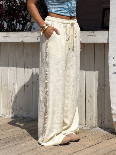 Muchica Quần ống rộng dáng suông thắt nút, chất liệu dệt màu mơ dành cho nữ.