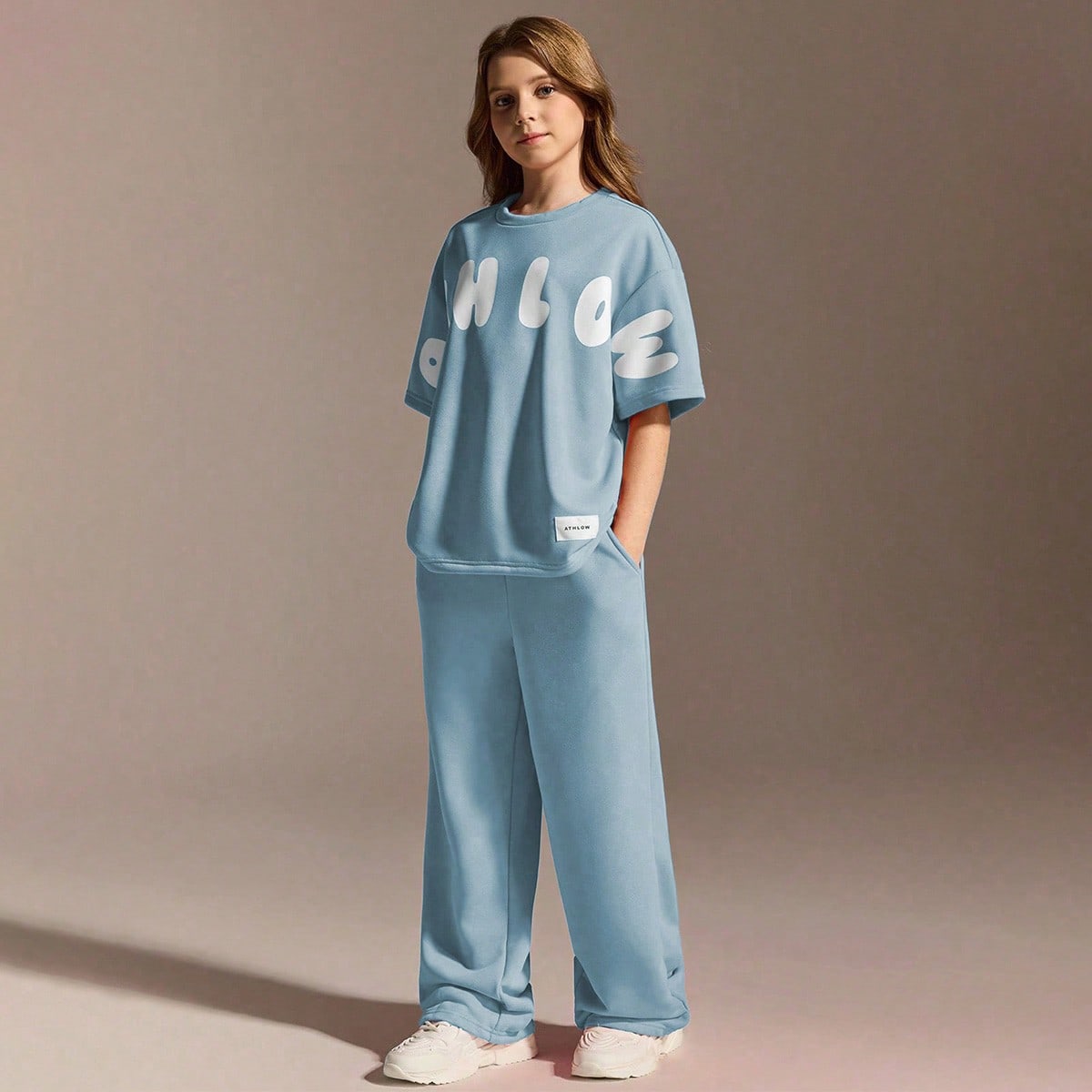 Conjunto deportivo casual para niñas, camiseta de cuello redondo holgada y pantalones relajados, el color melocotón agrega vitalidad juvenil, tela s