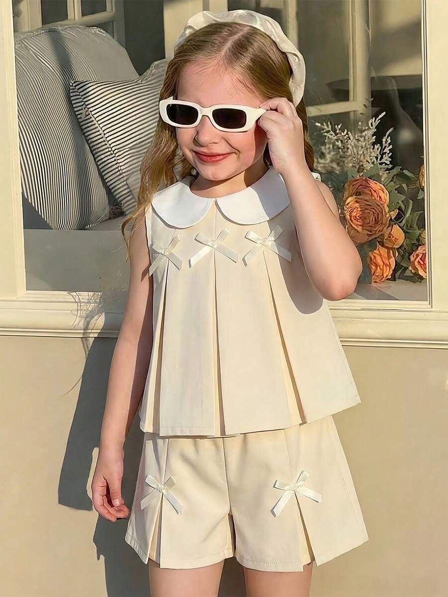 SHEIN Elladie kids Bộ đồ bé gái gồm áo vest xếp ly màu tím dễ thương có nơ trang trí, kết hợp với quần ống rộng thời trang, phù hợp cho mặc hàng ngày và đi làm, phong cách tối giản. - Màu be - Xem 1