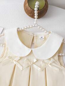 SHEIN Elladie kids Bộ đồ bé gái gồm áo vest xếp ly màu tím dễ thương có nơ trang trí, kết hợp với quần ống rộng thời trang, phù hợp cho mặc hàng ngày và đi làm, phong cách tối giản. - Màu be - Xem 8