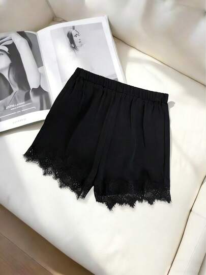 GlowEve Elegante, casual, losse en comfortabele zwarte shorts met contrasterende kanten details voor dames, zomer