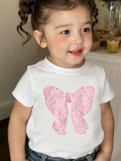 2026春夏新款时尚女童服装，甜美粉色蝴蝶结图案，百搭舒适圆领短袖T恤，适合春夏穿着，轻盈舒适的夏季上衣，印花T恤