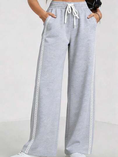 Pantalones anchos de chándal para mujer, cintura elástica con cordón blanco, detalle de encaje lateral, ideal para ocio diario
