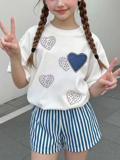 Set de 2 piezas para niñas preadolescentes: Camiseta de manga corta de cuello redondo holgada con estampado de corazón y pantalones cortos holgados a rayas, conjunto cómodo para primavera y verano