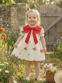 SHEIN 女童甜美碎花连衣裙，带蝴蝶结和荷叶边袖子，适合幼儿的公主裙，可爱日常穿着，白色底色搭配彩色印花 - 杏色 - 查看 15