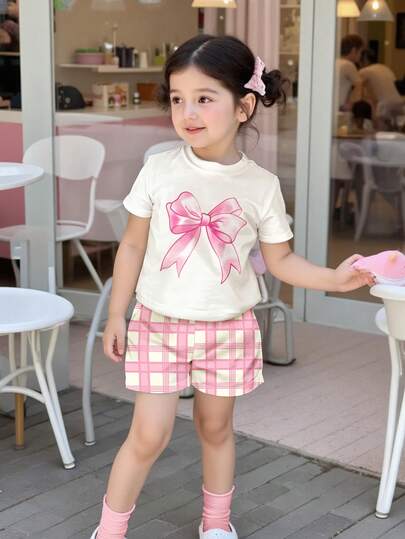 SHEIN 2pcs/Set Young Girls Casual Plaid Bow Decor Short Sleeve T-Shirt And Shorts Set, Suitable For Summer Vacation