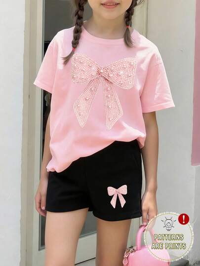 Set de 2 piezas de camiseta y pantalones cortos con estampado y decoración de moño, estilo casual y elegante para niñas, uso cómodo para primavera, verano y otoño