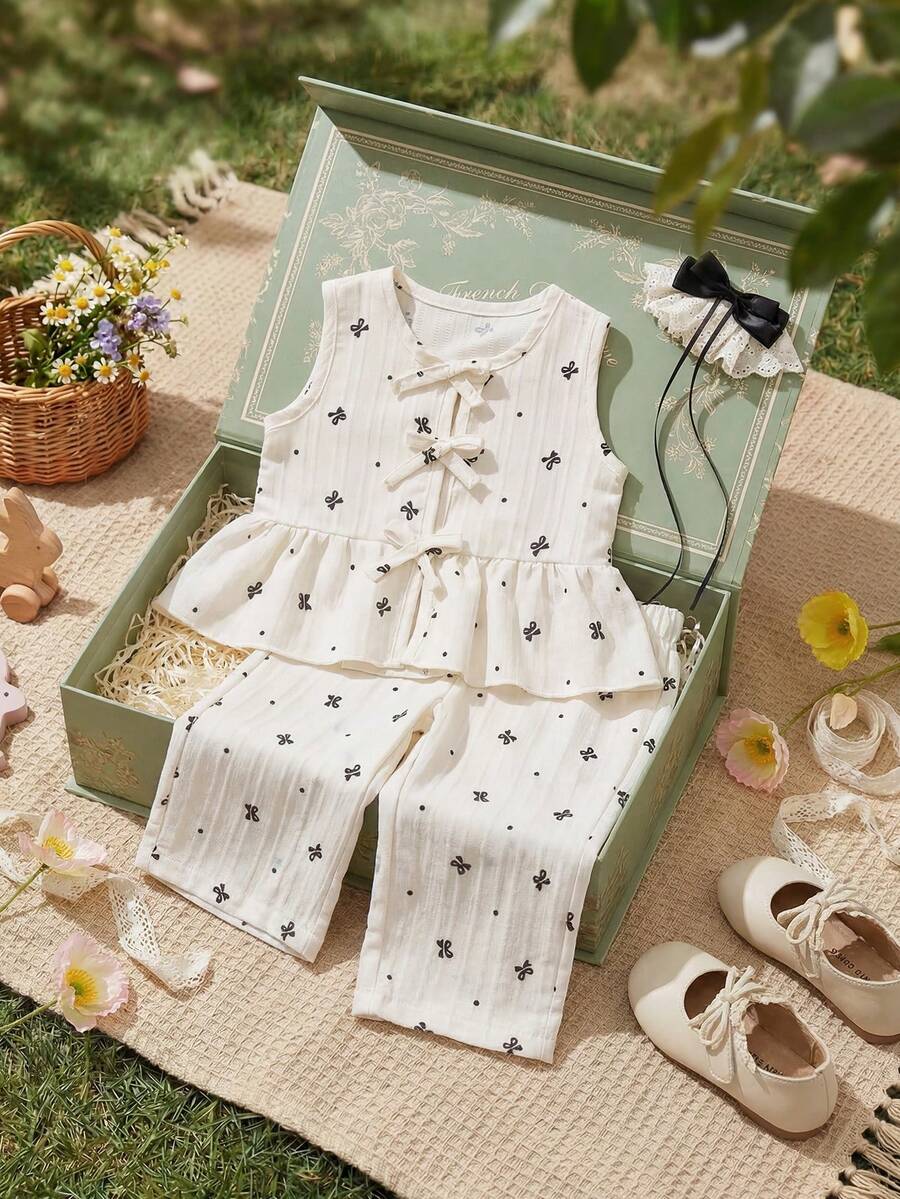 Souflis Souflis 2pcs Baby Girls' Milky White Delicate Black Print Sleeveless Ruffled Collar Shirt With Bow Decor And Elastic Waist Pants Set, Comfortable And Cute For Spring, Summer And Autumn Baby Girls Elegant Outfit Baby Girls Summer Outfit Sleeveless Top And Pants Set