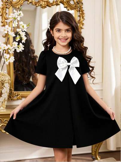 Elladie kids Đầm dệt kim tay ngắn màu trơn, dễ thương, kiểu dáng giản dị, thắt nơ không đều, xẻ tà, dành cho bé gái, thích hợp mặc mùa hè.