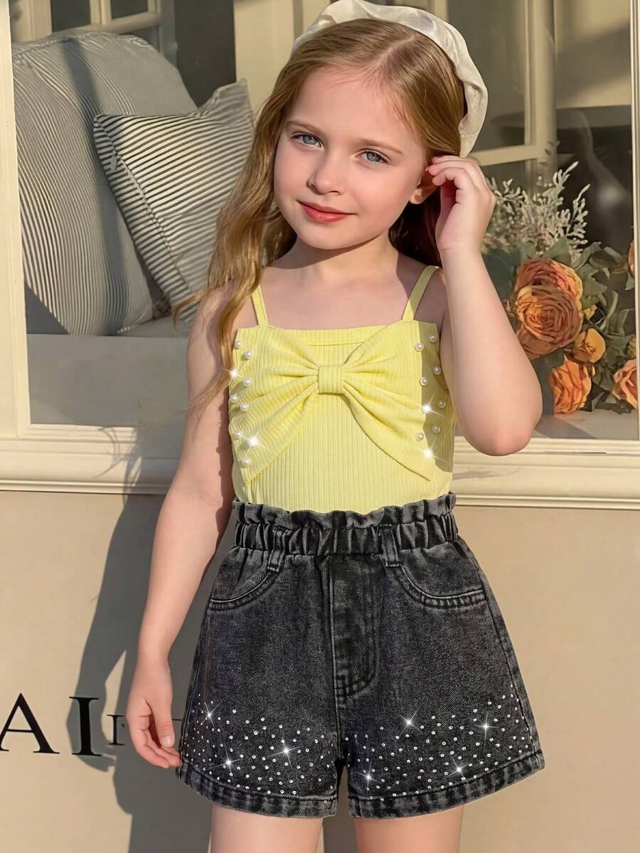 2pcs/Set Toddler Girls Summer New Ribbed Fabric Yellow Strap Top With Bow & Pearl Design, Black Denim Shorts With Rhinestone Hem, Simple Elegant Casual Holiday Outfit - Multicolor - View 1