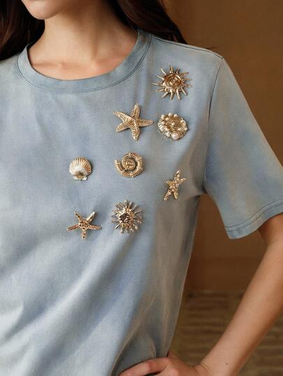 Anewsta Camiseta de mujer de manga corta con cuello redondo, de estilo vintage y casual, con temática de playa y océano, con elementos como estrellas de mar, conchas y botones metálicos decorativos, adecuada para primavera y verano