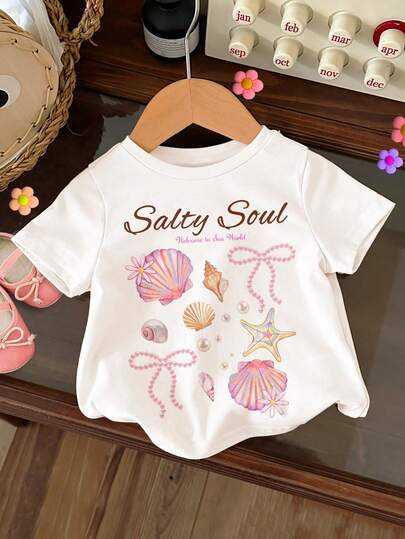 SHEIN 奶油白，Salty Soul 甜美海星贝壳珍珠蝴蝶结图案T恤，女婴休闲简约短袖圆领T恤，适合春夏日常、街头风、外出、度假、返校等场合，春夏女童外出穿搭，轻松舒适，春夏女童套装，时尚女童，休闲装，女婴海滩度假图案T恤，春夏时尚，休闲风格，轻松别致，轻松惬意穿搭，轻松休闲风