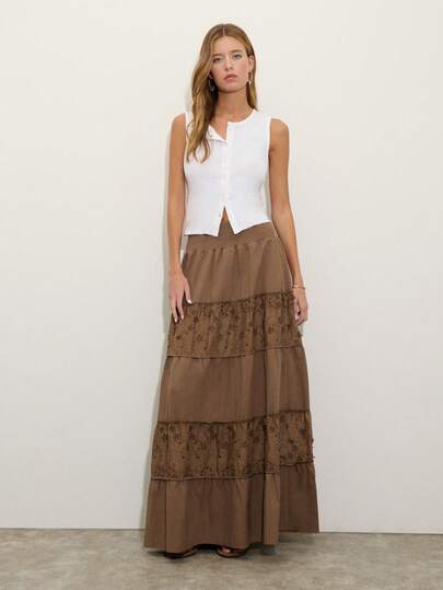 Nöista A Brown, High-Waisted, Layered Embroidered Maxi Skirt, Featuring Segmented Panels And Embroidered Lace Flowers, Exudes Bohemian Elegance. The Understated Color Is Versatile And Suitable For Casual Spring, Summer, And Early Autumn Occasions, Making It An Ideal Piece For Creating An Elegant Style.