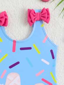 SHEIN GraphicGems Mädchen Badeanzug mit Eistüten Muster, Baby Mädchen Sommer neuer hautfreundlicher schnelltrocknender Badeanzug, Schleifendekor an den Schultern, Rüschenbesatz am Saum, volle Abdeckung, Hüftschutz, blendfreie Stil, Baby Mädchen Strandurlaub, Strand, Schwimmbad, Wasserpark, modisches Outfit, Baby Mädchen's lustiger und süßer Stil Essentiell - Verschiedenfarbig - Übersicht 3