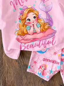 SHEIN 可爱美人鱼公主与花朵贝壳印花休闲宽松圆领短袖T恤和修身骑行短裤套装，适合春夏穿着，女童服装，韩版风格，可爱风，适合派对、日常、度假、田园风、周末休闲、家庭出游、拍照等场合。 - 彩色 - 查看 6
