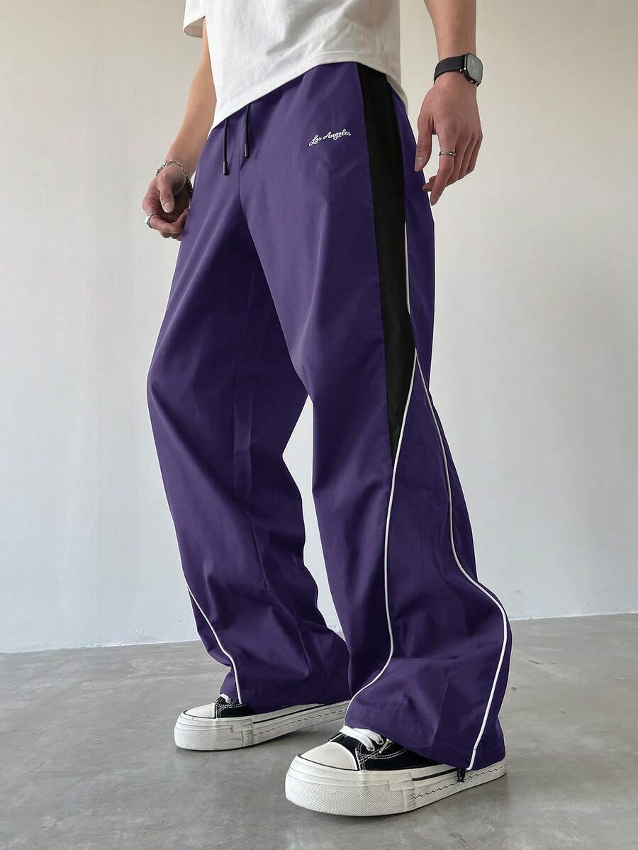 Manfinity EMRG Pantalon droit décontracté pour hommes avec cordon de serrage et blocs de couleurs, pantalon de survêtement droit ample et patchwork noir pour le football en extérieur - Prune - Voir 1