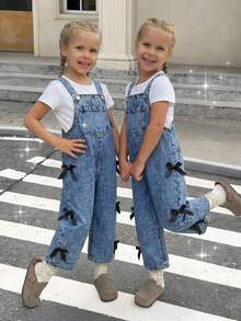 SHEIN   Girls Cute Bow Ribbons Details Denim Dungarees, With Adjustable Strapes, Flat Pockets On Front, Versatile Clothes For Kids, Versatile Outfit For Girls, Loose Fit Wide Leg Jean Dungarees, Stone Wash Medium Blue, Made With Good Quality Cotton Fabric, Cozy Handfeel, Spring Holiday Must Have Kids Wear , Spring Summer Girls Wear, Girls Must Have Daily Fashion Item, Preppy Style Kids Wear, Sweet Girls Fashion Item, Denim Wear For Girls, Young Girls Clothes. - Blue - View 7
