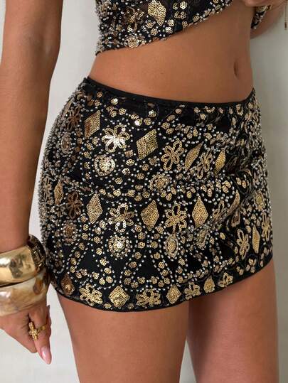 Glamine Black-And-Gold Sequin Embroidered Mini Skirt Featuring An Allover Vintage-Inspired Ornate Pattern And A Curve-Hugging Bodycon Fit-Perfect For Nights Out, Birthday Parties, New Year's Eve Celebrations, Girls' Nights, Cocktail Events, And Festival Outfits. Keywords: Sequin Skirt, Sparkly Mini Skirt, High-Waisted Mini Skirt, Bodycon Mini Skirt, Party Mini Skirt, Going-Out Outfit, NYE Outfit, Birthday Outfit, Festival Outfit. Gold Sequin Skirt Rhinestone Skirt