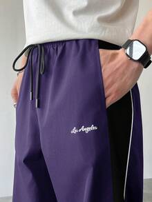Manfinity EMRG Pantalon droit décontracté pour hommes avec cordon de serrage et blocs de couleurs, pantalon de survêtement droit ample et patchwork noir pour le football en extérieur - Prune - Voir 6