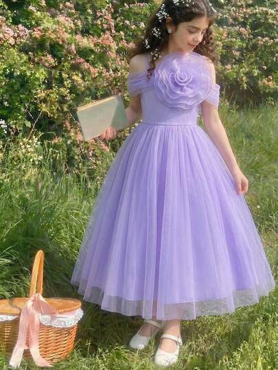 SHEIN Teen Girl Purple Evening Dress. The Whole Design Features A And Soft Style, Using Lightweight And Draping Mesh Fabric. The Asymmetric One Shoulder Cut Is Decorated With A 3D Floral Accent, Outlining An Elegant Neckline And Shoulder Line. The High-Waist Design Combined With A Full, Trailing Dress Creates A Graceful, Flowing Silhouette When Walking. The Soft Purple Tone Is Flattering And Suitable For Formal Occasions Like Galas, Annual Parties, And Weddings, Offering Both Fashionable And Ceremonial Elements To Create A Refined, Elegant Look.