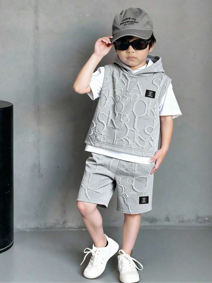 SHEIN Genkimix Kids Bộ đồ hè 2 món cho bé trai, gồm áo thun ngắn tay có mũ trùm đầu bằng vải dệt họa tiết phối màu tương phản, kết hợp với quần short thể thao ghép mảnh, kiểu dáng thể thao phù hợp cho mặc hàng ngày, đi nghỉ mát, chơi thể thao, đi học, nghỉ lễ. - Màu Xám nhạt - Xem 1