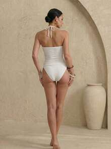 Anewsta Bộ bikini hai dây màu nâu đính hạt cườm, kiểu dáng thanh lịch, thích hợp cho kỳ nghỉ hè, bikini đi biển mùa xuân/hè dành cho nữ, trang phục hè 2026, váy đi biển, trang phục đi biển cho nữ, trang phục nghỉ hè thanh lịch, trang phục đi nghỉ mát cho nữ, bộ bikini cổ yếm đính hạt cườm bằng vải jacquard, đồ bơi nữ mới về mùa xuân/hè 2026, phù hợp cho đi học, kỳ nghỉ, hẹn hò, trà chiều, phong cách miền Tây, du thuyền, bãi biển, đảo, du lịch đường bộ, mọi mùa, lễ hội âm nhạc, kỳ nghỉ Boho, kỳ nghỉ Bohemian, mùa thu thư giãn, phong cách Boho miền Tây, áo kiểu thanh lịch cho nữ, áo quây trắng, áo ống, bộ bikini, áo ống, bộ đồ bơi cạp cao, bikini cạp cao màu trắng, bộ đồ bơi hai mảnh màu trắng, tankini trắng, áo ống trắng, trang phục đi biển màu trắng cho nữ. - Màu be - Xem 2