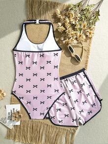 SHEIN Bộ đồ bơi liền thân cổ yếm in nơ cho bé gái tuổi teen, màu đen và hồng, in nơ + quần short cùng màu. Phong cách mùa hè mới, thân thiện với da và nhanh khô. Thiết kế lưng chữ Y, che phủ toàn bộ hông để tránh hở hang. Trang phục đi biển/hồ bơi sành điệu. Món đồ không thể thiếu cho phong cách ngọt ngào và nữ tính. Đồ bơi cho bé gái tuổi teen, đồ bơi cho tuổi teen, đồ bơi cho bé gái, lựa chọn mùa xuân hè, trang phục mùa hè cho nữ, bộ đồ bơi cho tuổi teen, đồ bơi dễ thương cho tuổi teen, đồ bơi che phủ toàn thân cho tuổi teen, đồ bơi liền thân. - Hồng - Xem 2