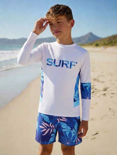 SHEIN Tween Boys Swimwear, Fresh Surfing Style, Solid White With Ombre Blue Gradient "SURF" Print, Raglan Sleeves And Sides With Tropical Leaf Print, Knit Fabric, Fashionable, Casual, Cool, Suitable For Swimming, Summer Vacation, Beach, Pool Party Boys Long Sleeve Swim Tween Boys Swim Shirt Tween Rash Guard Boys Swim Set Boys Rash Guard Surf Top Boys Long Sleeve Swim Shirt Kids Swimwear Boys Swim Top Rash Guard For Boys Long Sleeve Surf Top Kids Beach Wear Swimwear Long Sleeve Beach Wear For Kids Spring Summer Picks
