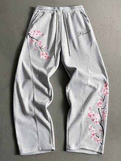 Manfinity EMRG Quần thể thao nam dáng rộng, thoải mái, phong cách thường ngày, đi làm, đi nghỉ mát, in chữ hoa anh đào, cạp chun, ống rộng, có dây rút.