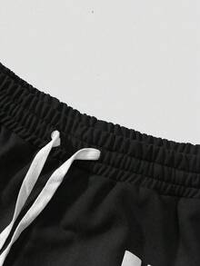 PAVTROS Quần short nam phong cách đường phố trẻ trung, thiết kế tối giản và độc đáo với họa tiết chữ cái và ngôi sao, cạp chun co giãn, túi có dây rút, mặt trước in họa tiết chấm bi phai màu, tổng thể mang phong cách đô thị, giản dị, thời trang đường phố, đa năng cho trang phục hàng ngày. Quà tặng dịp lễ. - màu đen - Xem 3