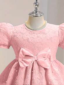 Đầm hè thanh lịch, sang trọng, cổ tròn, tay phồng, eo cao, màu trơn, chất liệu jacquard, nơ và đính ngọc trai. - Hồng - Xem 4