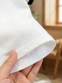 Souflis Souflis 女婴爱心图案圆领白色短袖套头T恤，饰有花边，婴幼儿服装，女童套头衫，女童短袖T恤，女童白色百搭短袖，精致花边工艺，爱心元素，纯色元素，适合春夏穿着，夏季，尺码6个月-3岁 - 白色 - 查看 5