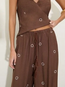 Nöista Two Pieces Set With A Halter V-Neck Top And Matching Wide-Leg Pants In Textured Brown Fabric With Sun Embroidery. . Perfect For Travel, Weekends, And Summer Days, Vacation Outfit, Boho, Festival, Spring, Holiday Look. - Brown - View 8