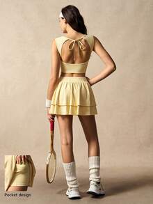 VARSIVA Bộ đồ thể thao nữ gồm áo tank top cổ tròn màu trơn và quần váy xếp ly. - Butter Yellow - Xem 11