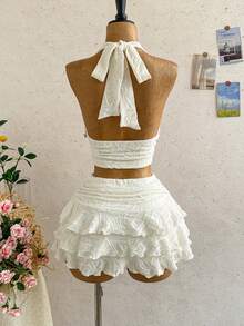 Soleia Bộ đồ 2 món dành cho nữ, gồm áo croptop cổ yếm viền sao biển và chân váy xếp tầng. - trắng - Xem 2