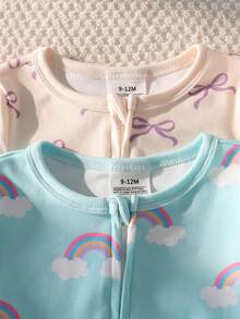 SHEIN Bộ đồ ngủ liền thân dài tay thoải mái, thời trang cho bé gái, gồm 2 món, điểm nhấn là nơ cầu vồng dễ thương. - Nhiều màu - Xem 4