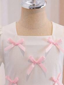 Glamorique Kids 1pc Young Girls' Square Neck Short Puff Sleeve Bowknot Decor Pink Cute Elegant Casual Dress, Suitable For Daily Outing, Travel, Party, Summer, Soft & Comfortable Fabric, 2026 Spring/Summer New Fashion Bubble Dress For Kids Young Girl Dresses Kids Puff Sleeve Dress Charming Kids Dresses White Dress With Pink Bows - White - View 8