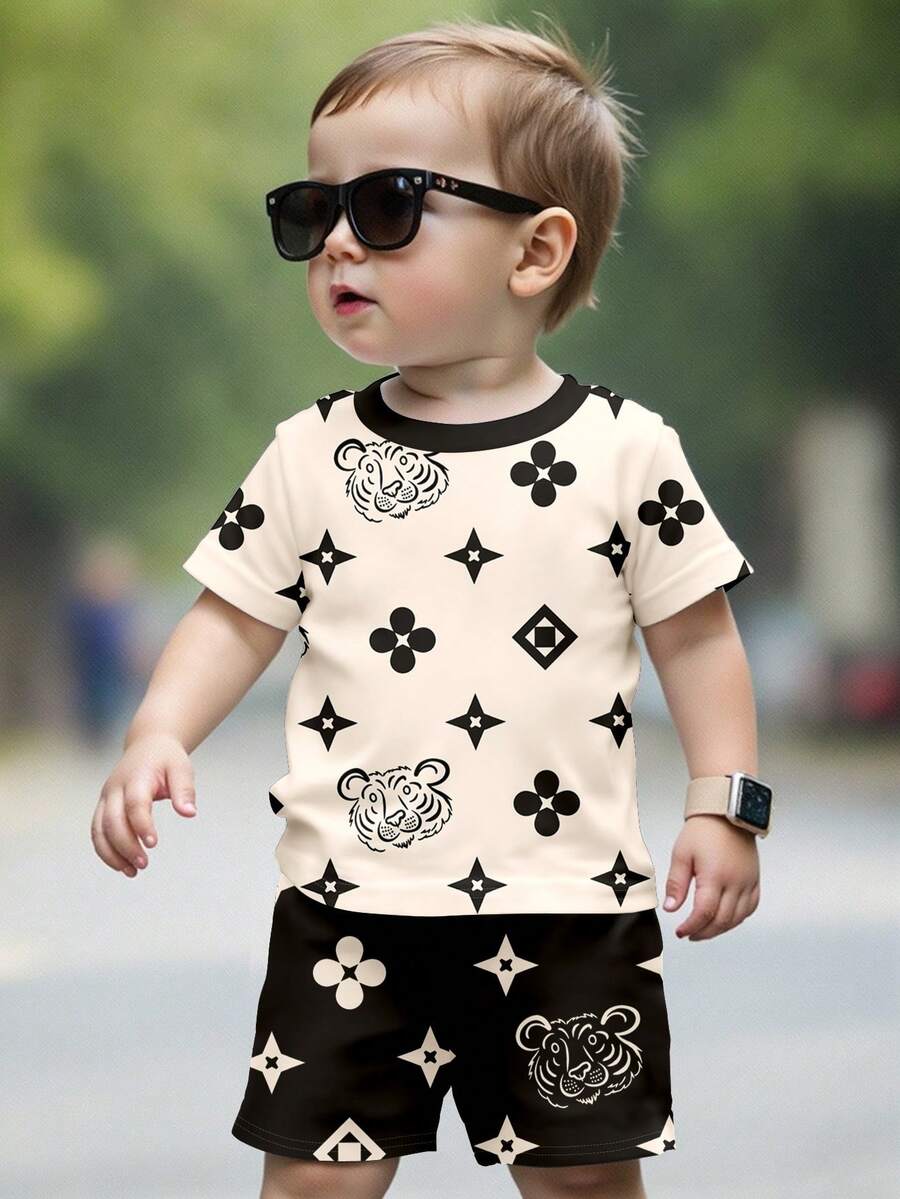 SHEIN Conjunto de Camiseta de Manga Curta e Shorts Minimalista Casual para Bebê Menino, Gola Redonda, Adequado para o Verão, Conjunto de Camiseta de Manga Curta e Shorts Minimalista Casual para Bebê Menino, Estampa Floral Clássica, Conjunto de Camiseta de Manga Curta e Shorts Minimalista Casual para Bebê Menino, Estampa de Tigre Estilizada, Estampa Floral - Multicolorido - Visão 1
