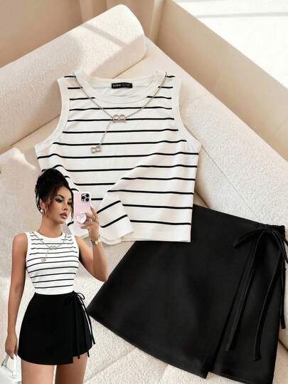 Franclia Women's Solid Color White And Black Striped Sleeveless Off-Shoulder Top Paired With Solid Black Side-Tie Culottes/Shorts, A-Line Silhouette, Slim Fit, Flattering Two-Piece Set. Suitable For Commuting, Everyday Wear, Summer, Summer Tops, Summer Outfits, Summer Clothing, Summer Outfits, Beach, Women's Beach Outfits, Beach Outfits, Women's Vacation Outfits, Vacation And Holiday, Summer Holiday Outfits, Holiday Outfits, Y2K Style, Women's Commuting Outfits, Women's Office Outfits, Social/Workwear Tops, Women's Work Attire, Women's Office Wear, Women's Office Wear, Striped Tops, Striped Shirts, Striped Vests, Black Shorts, Striped Suits, Black Suits.Graduation Season Attire, Fashionable Casual Commuter Wear, Business Office Wear, Versatile And Stylish Everyday Casual Wear, Urban Teacher's Professional Attire
