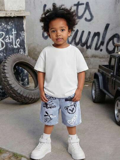 SHEIN Young Boy Urban Street Style Y2k Distressed Teddy Bear Graffiti Print Stonewashed Loose Fit Blue Denim Bermuda Jeans Shorts Spring Summer,For Kids Boys Spring/Summer Dailywear Outfits,Boys Streetwear Outifits,Festival Outfits For Boys,Party Outfits For Boys,Beach Outfits For Boys,Boys Graduation Outfit,Casual Boys Outfits,Summer Vacation Outfits For Boys,Graphic Jeans Boys,Toddler Shorts,4-Years-Old Boys Shorts,Casual Shorts,Summer Shorts,Boys Shorts,Denim Shorts,Graphic Shorts,Kids Shorts